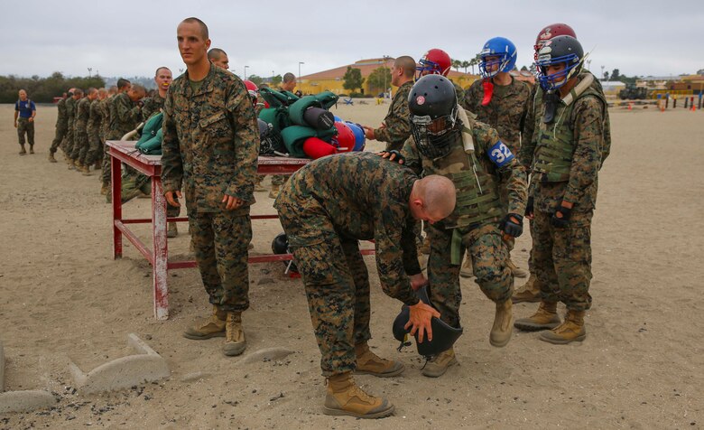 Recruits from India Company, 3rd Recruit Training Battalion, prepare to compete against each other during Pugil Sticks III at Marine Corps Recruit Depot San Diego, June 21. Recruits were given protective gear that consisted of a flak jacket, groin protector, helmet and a pugil stick that simulated a rifle. Annually, more than 17,000 males recruited from the Western Recruiting Region are trained at MCRD San Diego. India Company is scheduled to graduate July 15.