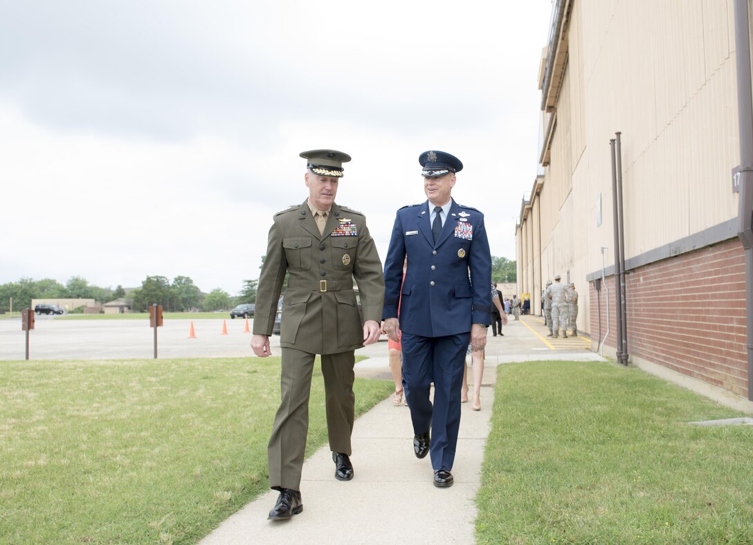 Marine Corps Gen. Joe Dunford, chairman of the Joint Chiefs of Staff, left, greets Maj. Gen. Darryl W. Burke, Commander of the Air Force District of Washington and the 320th Air Expeditionary Wing, before the retirement ceremony for Air Force Chief of Staff Gen. Mark A. Welsh III at Joint Base Andrews, Md., June 24, 2016.  