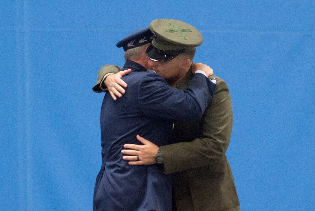 Air Force Chief of Staff Gen. Mark A. Welsh III hugs his son, Marine Corps 1st Lt. Matthew Welsh, during his retirement ceremony at Joint Base Andrews, Md., June 24, 2016. DoD Photo by Navy Petty Officer 2nd Class Dominique A. Pineiro
