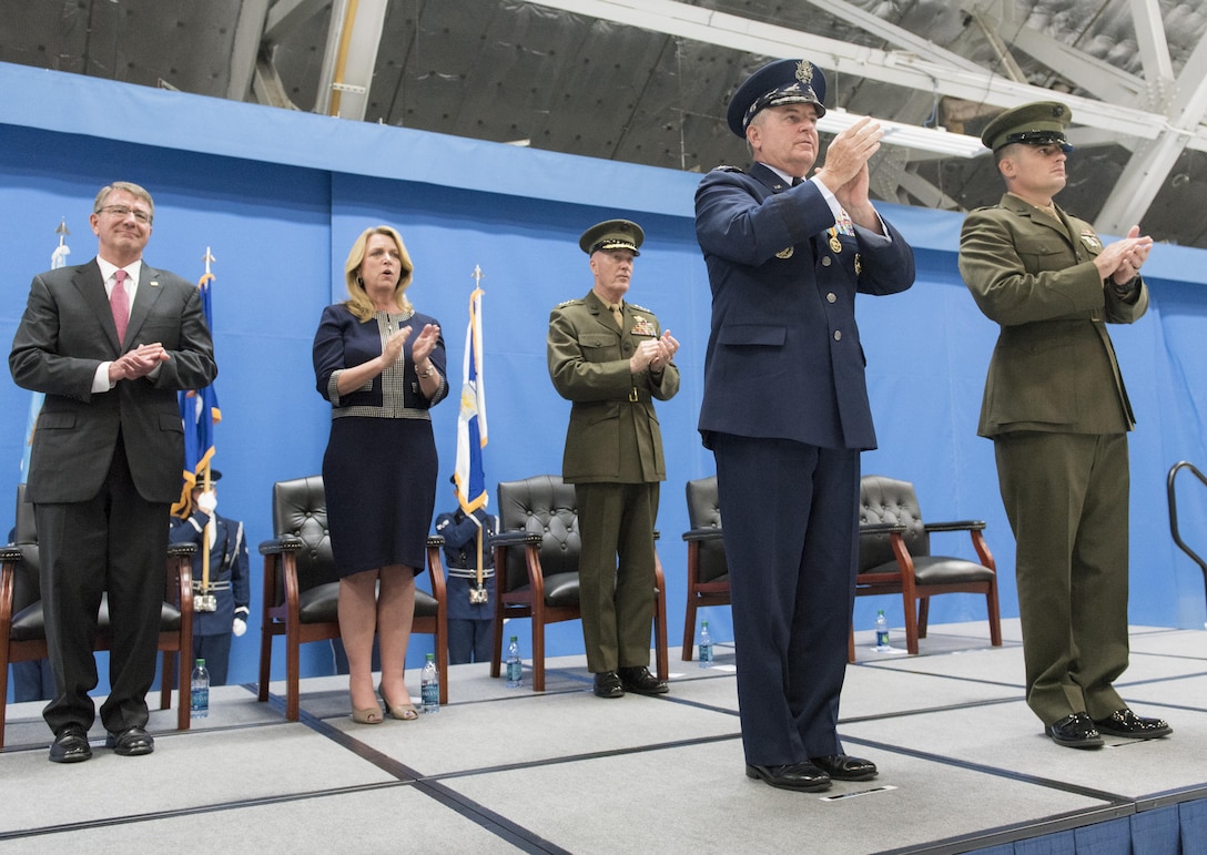 From left, Defense Secretary Ash Carter, Air Force Secretary Deborah Lee James, Marine Gen. Joe Dunford, chairman of the Joint Chiefs of Staff, Air Force Chief of Staff Gen. Mark A. Welsh III, and Marine 1st Lt. Matthew Welsh, recite the U.S. Air Force Hymn during Gen. Welsh's retirement ceremony at Joint Base Andrews, Md., June 24, 2016. DoD photo by Navy Petty Officer 2nd Class Dominique A. Pineiro

