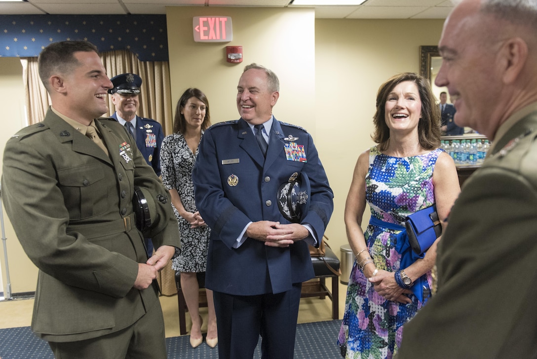 Air Force Chief of Staff Gen. Mark A. Welsh III, center, his wife Betty Welsh, and their son, Marine Corps 1st Lt. Matthew Welsh, left, chat with Marine Corps Gen. Joe Dunford, chairman of the Joint Chiefs of Staff, before Welsh's retirement ceremony at Joint Base Andrews, Md., June 24, 20156. Welsh became chief of staff in August 2012. DoD photo by Navy Petty Officer 2nd Class Dominique A. Pineiro

