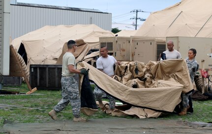 U.S. Army Reserve Soldiers of the Pacific, 303rd Maneuver Enhancement Brigade, 9th Mission Support Command, relocates a portion of a Deployable Rapid Assembly Shelter in support of break-down operations during exercise Imua Dawn 2016, Sagamihara Depot, Kanagawa, Japan, June 24, 2016.  Imua Dawn 2016 focused on maneuver support operations and enhancing cooperative capabilities in mobility, Humanitarian Assistance and Disaster Relief (HADAR), Noncombatant Evacuation Operations (NEO), and sustainment support in the event of natural disasters and other crises that threaten public safety and health in the Pacific region.