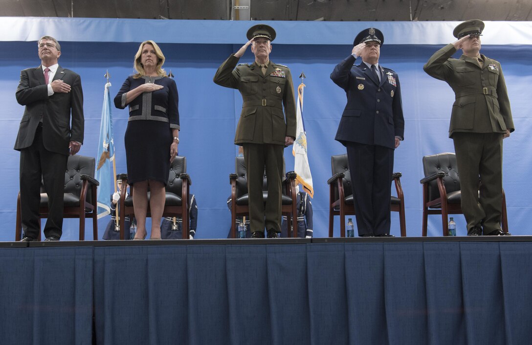 From left, Defense Secretary Ash Carter, Air Force Secretary Deborah Lee James, Marine Gen. Joe Dunford, chairman of the Joint Chiefs of Staff, Air Force Chief of Staff Gen. Mark A. Welsh III, and Marine 1st Lt. Matthew Welsh, render honors as the colors are presented during Gen. Welsh's retirement ceremony at Joint Ba ...More
