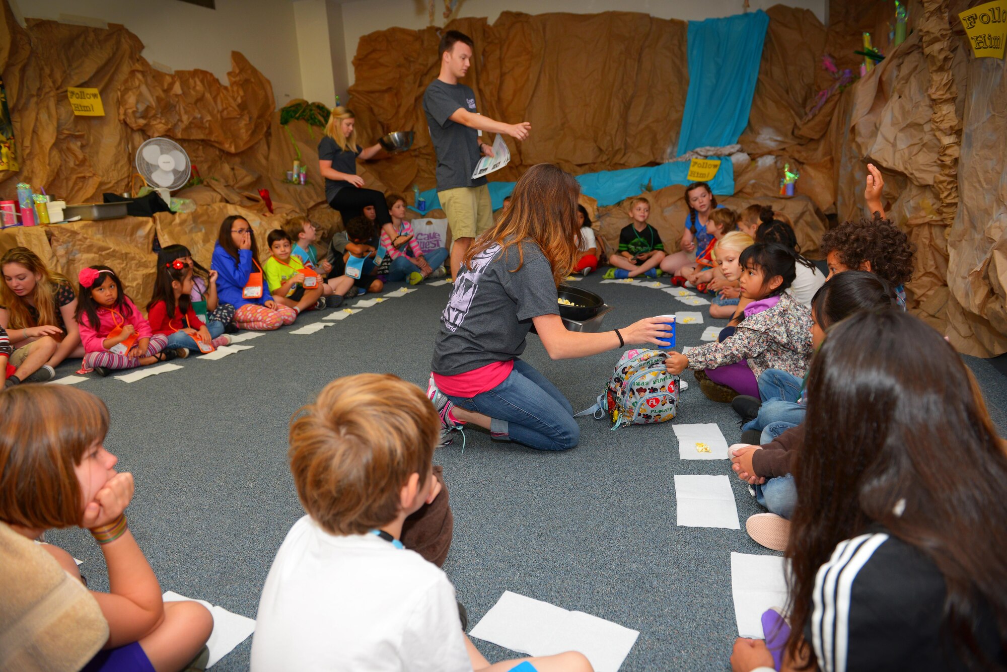 Children receive popcorn during one of their lessons during Yokota’s Annual Vacation Bible School at Yokota Air Base, Japan, June 22, 2016. The main base chapel invited Yokota personnel to bring their children to participate in a week of interactive, group activities with the theme of “Cave Quest: Following Jesus, the light of the world.” (U.S. Air Force photo by Airman 1st Class Elizabeth Baker/Released)
