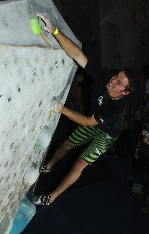 U.S. Marine Corps Sgt. Michael Eckert reaches for a hold during the 2011 Aiguille Rock Climbing Competition in Orlando, Fla. After almost a decade of rock climbing, Eckert has utilized the strength he’s built from this sport to achieve many athletic goals as a competitor and now as a U.S. Marine. Eckert is currently station at Marine Corps Air Station Iwakuni, Japan, where he serves as a motor transport mechanic with Marine Wing Support Squadron 171. (Courtesy Photo)