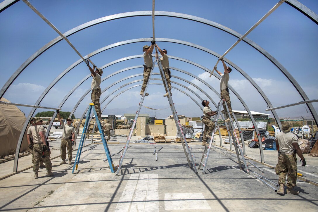 Airmen work to construct a new tent at Bagram Airfield, Afghanistan, June 25, 2016. Air Force photo by Senior Airman Justyn M. Freeman