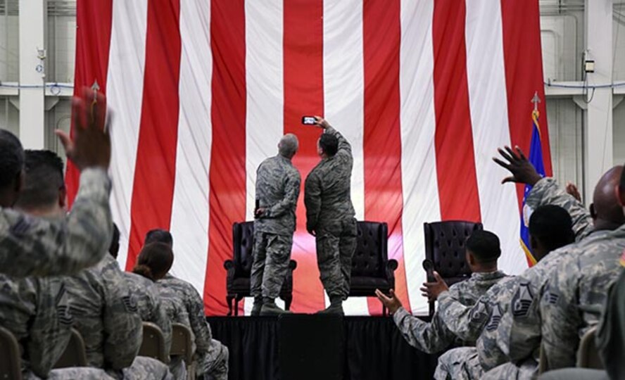 Freedom Wing leadership take a selfie Saturday at the start of the, standing room only, bi-annual commander's call. Col. David Pavey, right and Command Chief Master Sgt. Kevin Warbrick, left, recognized award winners, relayed command messages and thanked the wing's Reserve members for their continued military service. (U.S. Air Force photo by Senor Airman Terry Clyburn II)