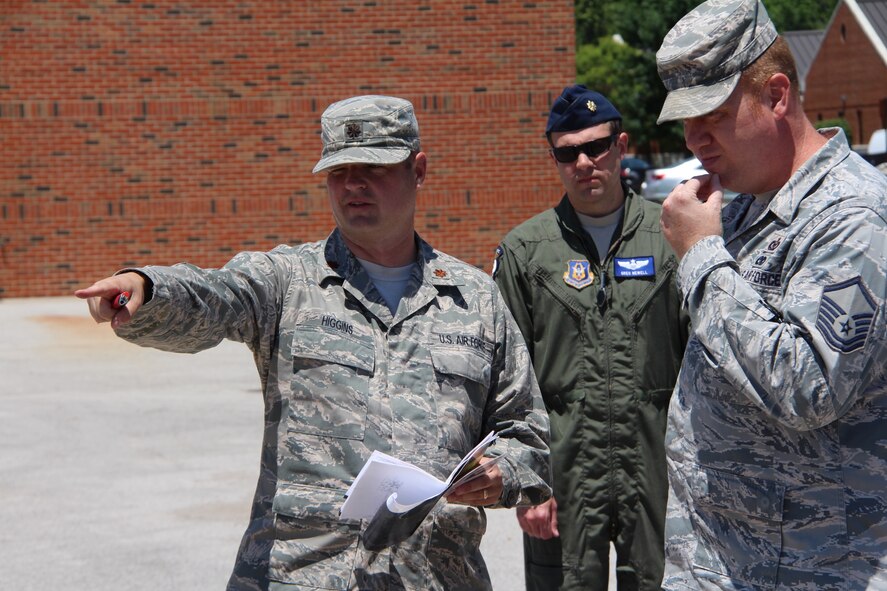 Maj. Chris Higgins, 12th Operational Weather Flight, talks with 932nd Safety Officer Maj. Greg Newelland and Safety NCOIC, Master Sgt. Michael Burgess, during a summer training event with the Madison County Community Emergency Response Team or CERT.  The program in conjunction with St. Clair County, teaches potential first responders about some things to expect while waiting for emergency crews to get to a scene.  It is a realistic approach to emergency and disaster situations where citizens may initially be on their own until emergency personnel can arrive.(U.S. Air Force photo by Maj. Stan Paregien)