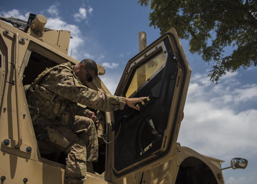 Staff Sgt. Gary Allsbrook, 455th Expeditionary Security Forces Squadron quick reaction force, gets into a mine-resistant ambush-protected (MRAP) all-terrain vehicle (M-ATV), June 27, 2016, Bagram Airfield, Afghanistan. MRAP M-ATVs are one of the many vehicles that help the 455th ESFS conduct their patrols to keep flightline secure. (U.S. Air Force photo by Senior Airman Justyn M. Freeman)