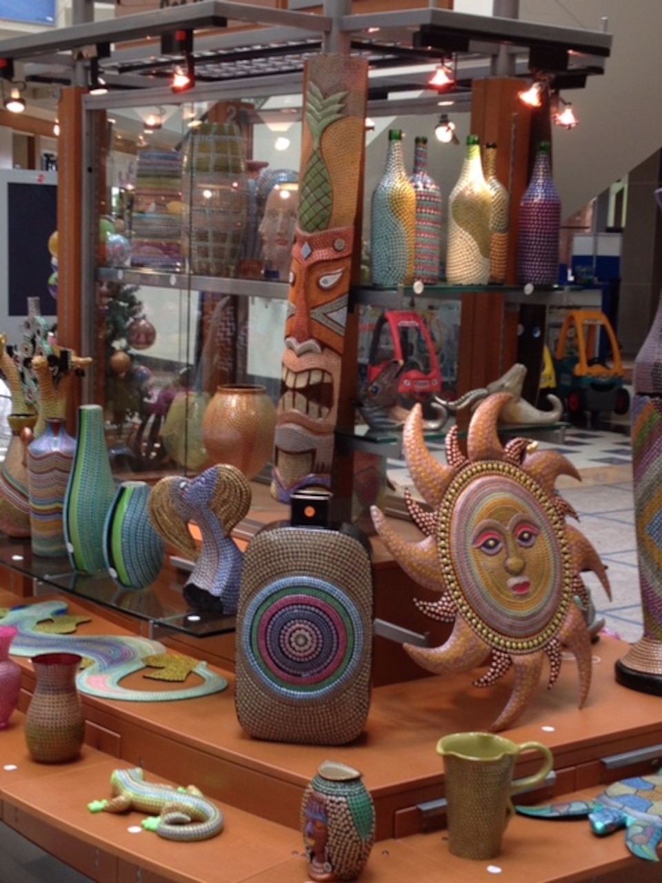 Army veteran Greg Mullen has created animal figures, Southwestern sun faces, vases, as well as  a life-sized suit of armor and a coffee table with a "dot" art technique he developed to help him cope with post-traumatic stress disorder. While a small item takes him a half day to fill with about 400 dot patterns, his prized coffee table took three months to complete, with at least 50,000 layered dots. Courtesy photo

