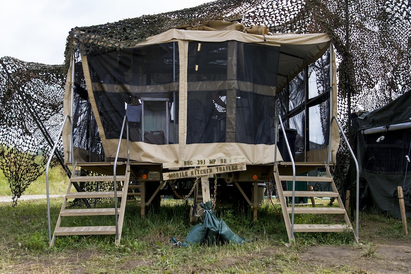 The 391st Military Police Battalion mobile kitchen trailer waits for the unit’s culinary specialists to prepare a nutritious meal in a field environment during the Philip A. Connelly Competition at Camp Atterbury, Indiana, June 23. The 391st is representing the 200th MP Command in the competition, part of a training program designed to improve professionalism and recognize excellence, which augments the quality of food and food service within the Army. The top four food service teams will continue to the U.S. Army Reserve level competition. (U.S. Army photo by Sgt. Audrey Hayes)