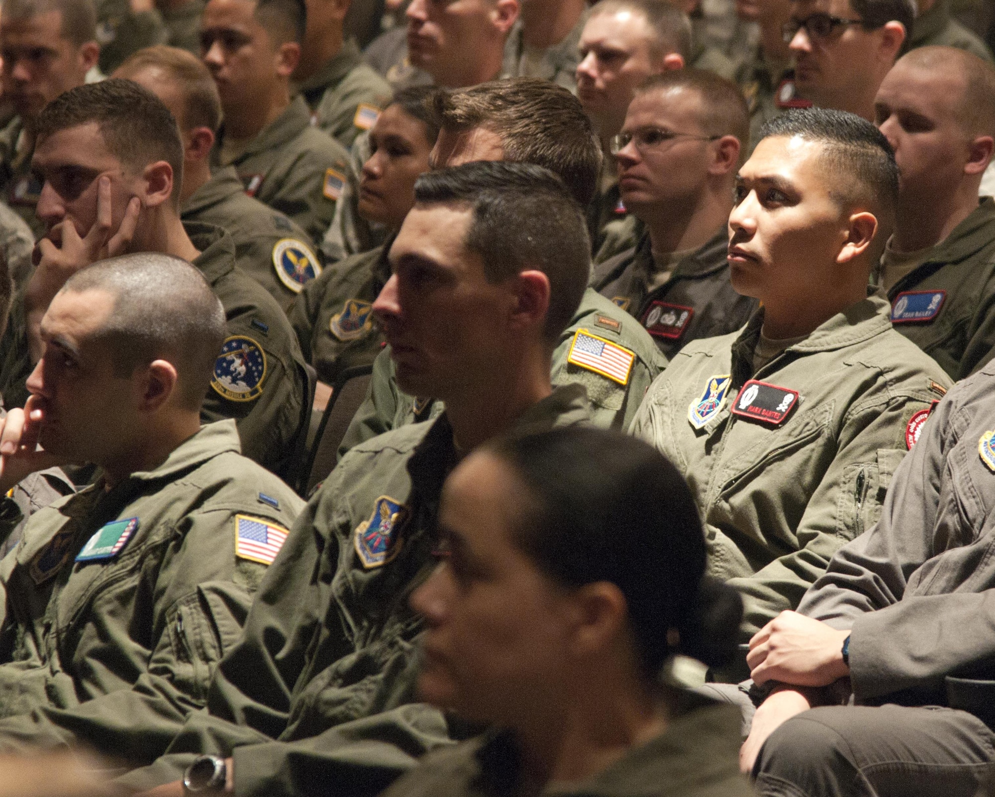 90th Operations Group Airmen listen to Maj. Gen. Anthony Cotton, 20th Air Force and Task Force 214 commander, discuss the final restructure plan to the Nuclear and Missile Operations career field during a commander’s call in the F.E. Warren Air Force Base, Wyo., theater June 23, 2016. The restructure will be a four to five year process beginning in fiscal-year 2017. (U.S. Air Force photo/Airman 1st Class Malcolm Mayfield)