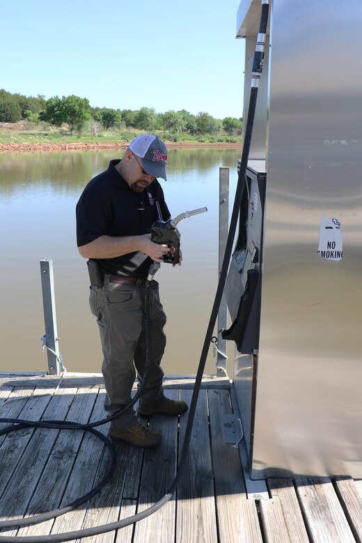 Jason Person, environmental specialist for the U.S. Army Corps of Engineers Tulsa District, inspects a gas pump at a marina on Kaw Lake during an Environmental Review Guide for Operations or ERGO, May 10, 2016.  Person is the lone environmental specialist for Tulsa Districts Northern Area, a huge area of land covering approximately 15,000 square miles and 13 USACE projects. (USACE photo by Thomas Mills/Released)