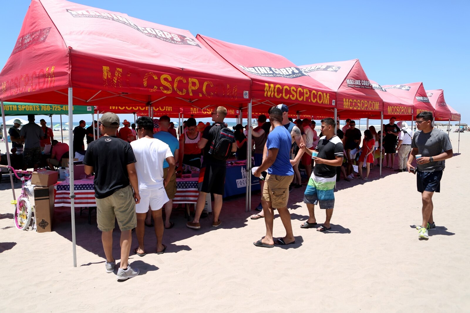 Marines, Sailors and family members of Combat Logistics Battalion 5, 1st Marine Logistics Group, enjoy food, fun, and festivities hosted by volunteers from Saddleback Church and Marine Corps Camp Services aboard Camp Pendleton, Calif., June 17, 2016. Aside from offering service members and their families some time to come together and relax, the event supported the 101 Days of Summer Campaign, which aims to promote increased safety during the summer months. (U.S. Marine Corps Photos by Sgt. Carson Gramley/released)