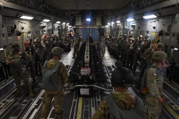 Paratroopers from the U.S. Army’s 82nd Airborne Division and France prepare to conduct a static-line jump from a 62nd Airlift Wing C-17 Globemaster III June 22, 2016, near Libreville, Gabon, during exercise Central Accord 2016. The U.S. Army Africa exercise is an annual, combined, joint military exercise that brings together partner nations to practice and demonstrate proficiency in conducting peacekeeping operations. (U.S. Air Force photo/Tech. Sgt. Tim Chacon)