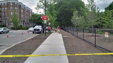 Note the new loam on impacted landscaped areas, ready for hydroseed; and the installed temporary landscape protection fencing.