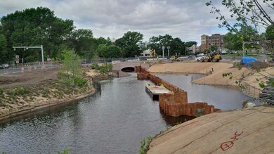 Filling of the northside of the FRM channel once the lower portion of the channel was constructed; note the continued planting on the southside of the bank of the channel.
