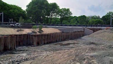 Note the shaping of the bank on the northside to construct the FRM channel and the beginning of planting on the southside of the channel.