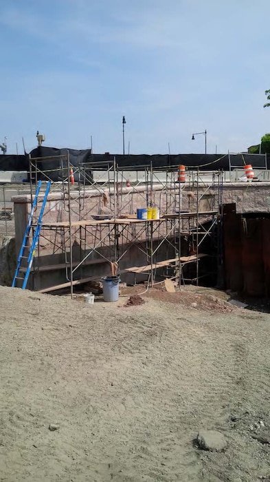 The Muddy River Flood Risk Management (FRM) & Environmental Restoration Phase 1 Construction Installing granite veneer on the northwest wing wall
Project is located in between the Riverway downstream to Avenue Louis Pasteur. The major project components involve the installation of a 10-foot by 24-foot box culvert under Riverway, the installation of 10-foot by 24-foot box culvert under Brookline Avenue, daylighting of the area between Riverway and Brookline Avenue, and daylighting of the area between Brookline Avenue and Avenue Louis Pasteur. Daylighting is the removal of existing twin 72" culverts and excavation of the area to return the waterway to a natural state.