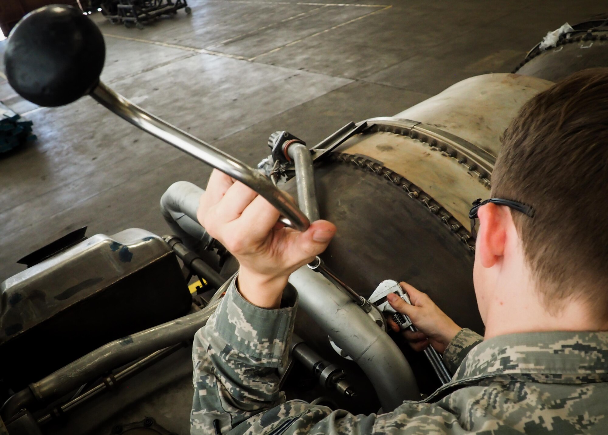 Senior Airman Jovie Abaya, 96th Aircraft Maintenance Unit aerospace propulsion technician, fastens a speed handle into a sized socket at Barksdale Air Force Base, La., June 22, 2016. Propulsion technicians train to provide on-site flightline maintenance to aircraft at a moment’s notice and have access to a variety of toolkits with the capability to repair most issues. (U.S. Air Force photo/Senior Airman Mozer O. Da Cunha)