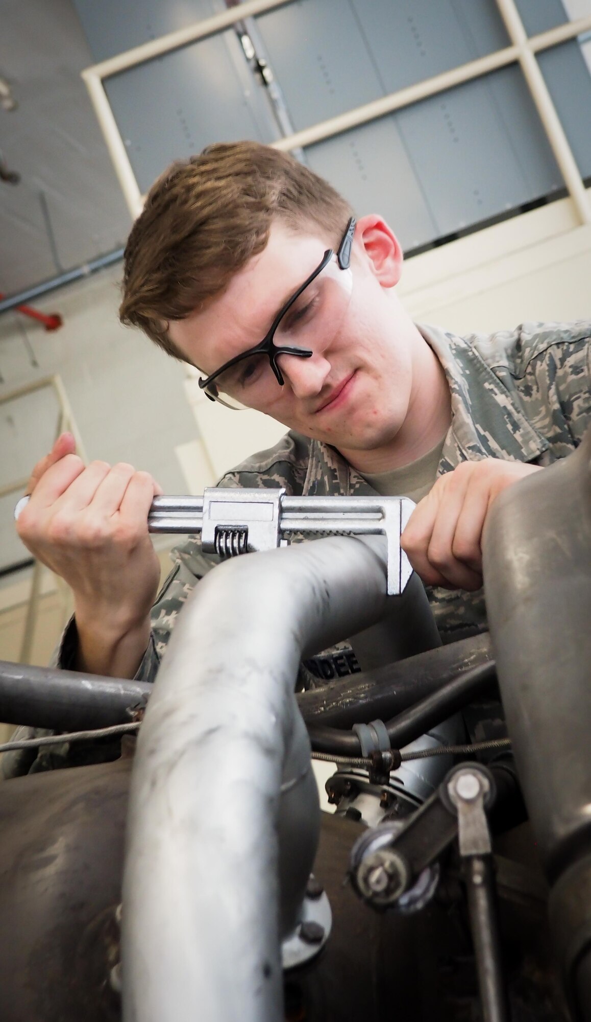 Senior Airman Jovie Abaya, 96th Aircraft Maintenance Unit aerospace propulsion technician, fastens a speed handle into a sized socket at Barksdale Air Force Base, La., June 22, 2016. Propulsion technicians train to provide on-site flightline maintenance to aircraft at a moment’s notice and have access to a variety of toolkits with the capability to repair most issues. (U.S. Air Force photo/Senior Airman Mozer O. Da Cunha)