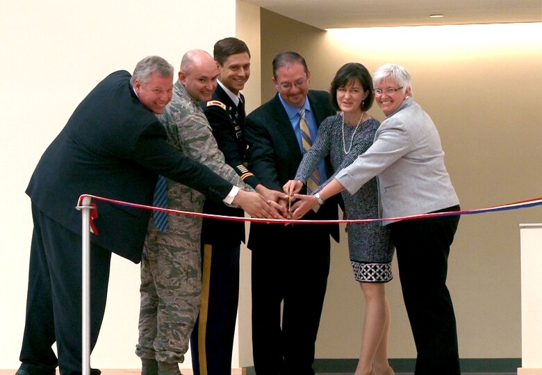 Dignataries cut the ribbon on the new Hanscom Middle School. 