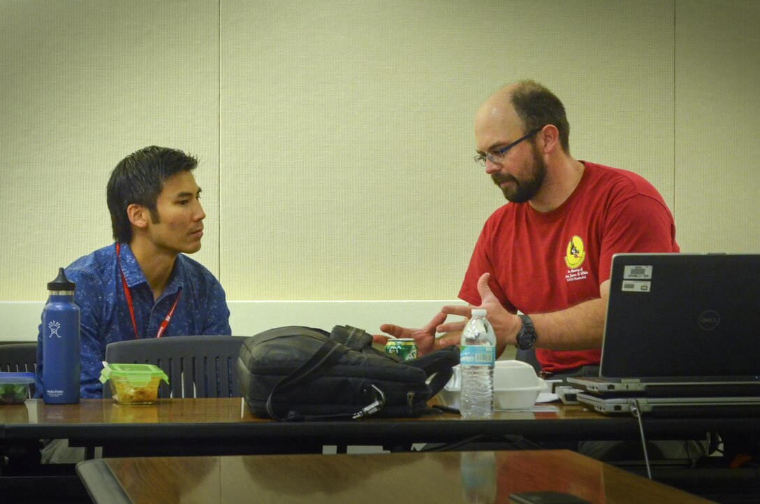 Joe Griffin (right), senior archeologist for the U.S. Army Corps of Engineers Sacramento District, speaks to a colleague after finishing a brown-bag seminar May 12, 2016, at district headquarters in Sacramento, California. Griffin spoke about leading an expedition to recover the remains of an American pilot shot down during the Vietnam War era in the Xiangkhoang Province, Lao People’s Democratic Republic earlier in the year and discussed his experiences working with a multi-disciplinary team from the Defense POW/MIA Accounting Agency. (U.S. Army photos by Randy Gon / Released)