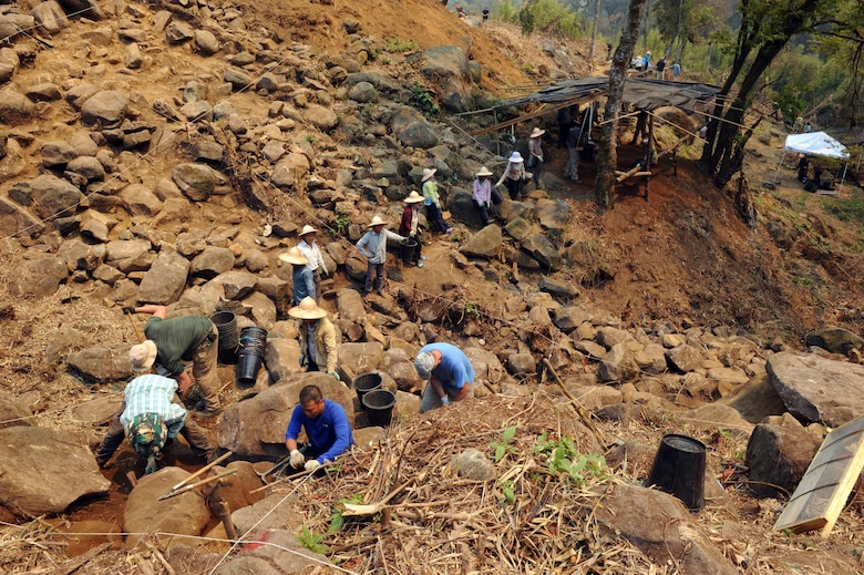 A team from the Defense POW/MIA Accounting Agency (DPAA) work with local Hmong villagers during site excavation in the Xiangkhoang Province, Lao People’s Democratic Republic, Mar. 18, 2016. Members of the DPAA deployed to the area in hopes of recovering the remains of a pilot unaccounted for since the Vietnam War era. (DoD photo by Staff Sgt. Jocelyn Ford, USAF/RELEASED)