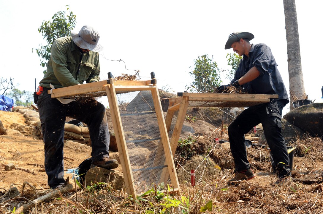 Joe Griffin (left), senior archeologist for the U.S. Army Corps of Engineers, and Petty Officer 2nd Class Cody Wilcoxson use mobile screening stations to examine excavated dirt in the Xiangkhoang Province, Lao People’s Democratic Republic on Mar. 19, 2016. Members of the Defense POW/MIA Accounting Agency deployed to the area in hopes of recovering the remains of a pilot unaccounted for since the Vietnam War era. (DoD photo by Staff Sgt. Jocelyn Ford, USAF/RELEASED)
