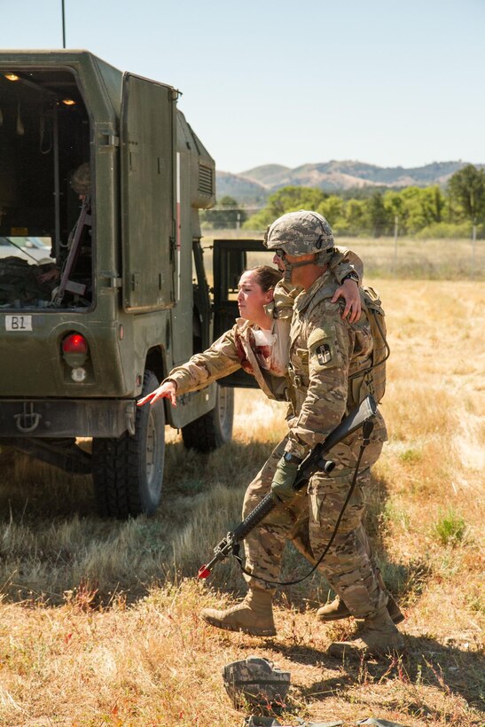 U.S. Army Soldiers from the 441st Medical Company respond to assist causalities at the site of a (simulated) helicopter crash on May 9th, 2016 at Ft. Hunter Liggett, Calif. The level of realism was increased by using live role players with simulated injuries to simulate "real world" casualities. The Soldiers were participating in the 91st Training Division's WAREX 2016.(U.S. Army photos by 1LT Kevin Braafladt 91st Training Division Public Affairs/Released)  #91TD2016WAREX