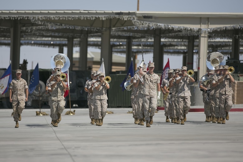 The 1st Marine Division Band performs during the 1st Tank Battalion change of command ceremony held at the tank ramp, June 22, 2016. During the ceremony Lt. Col. Lee Rush relinquished command of the battalion to Lt. Col. Christopher Meyers. (Official Marine Corps photo by Cpl. Thomas Mudd/Released)