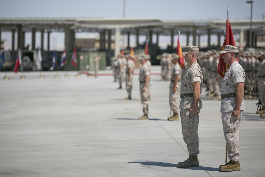 Marines of 1st Tank Battalion stand at attention during the battalion’s change of command ceremony at the tank ramp, June 22, 2016. During the ceremony Lt. Col. Lee Rush relinquished the command of the battalion to Lt. Col. Christopher Meyers. (Official Marine photo by Cpl. Thomas Mudd/Released)
