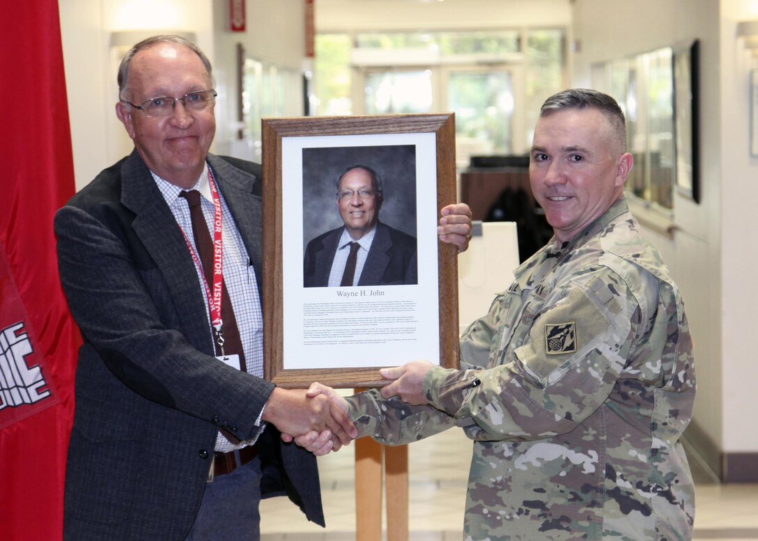 U.S. Army Corps of Engineers, Walla Walla District Commander Lt. Col. Timothy Vail honored Wayne H. John, retired Walla Walla District chief of Operations Division, as the Distinguished Civilian Employee of the Year during an award ceremony held June 24 at the District Headquarters in Walla Walla, Washington.  