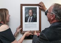 Wayne H. John, retired Walla Walla District chief of Operations Division, and his wife, Glenda, add Wayne’s portrait to the Distinguished Civilian Employee of the Year gallery in the District Headquarters during a June 24 ceremony in Walla Walla, Washington.
