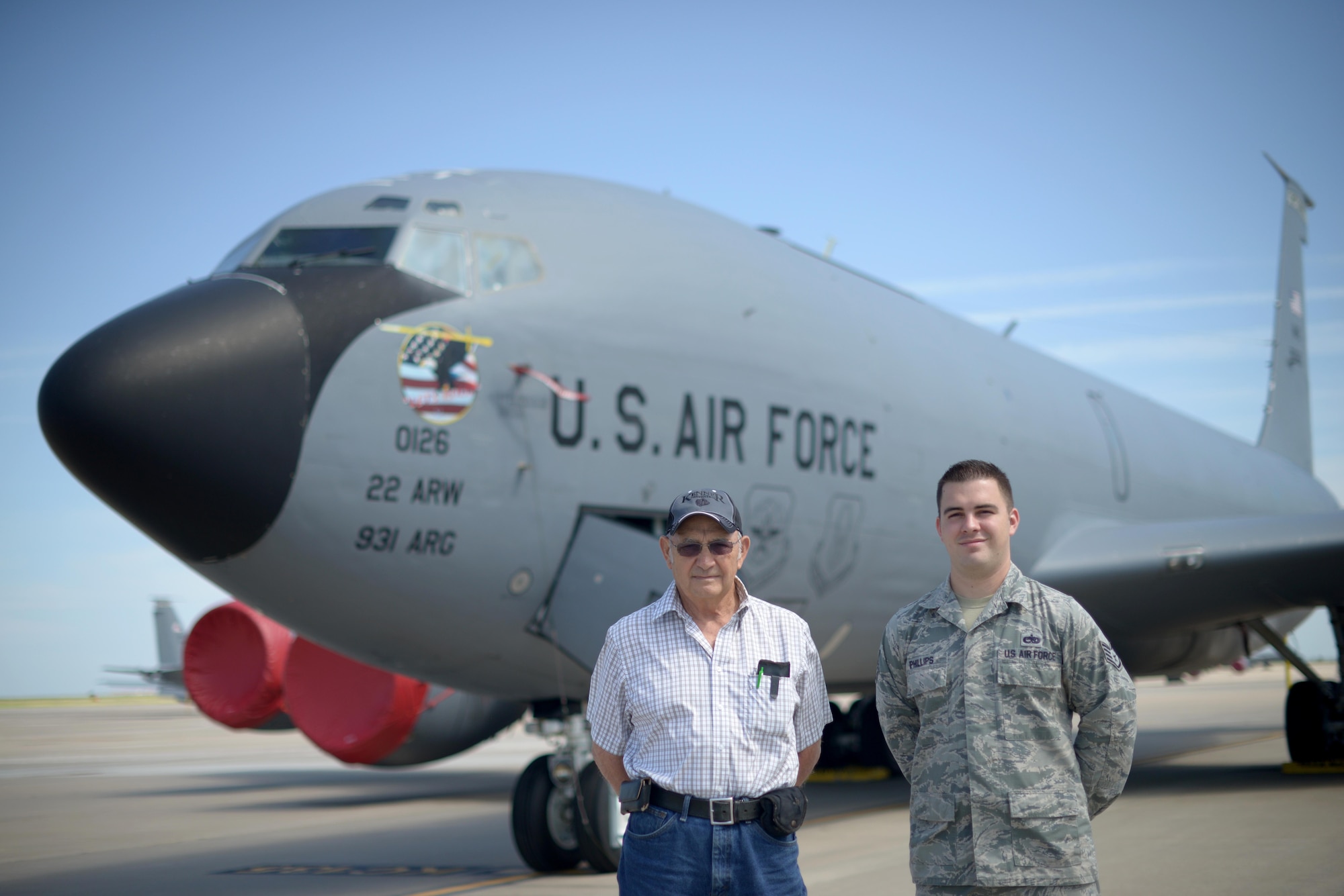 Staff Sgt. Austin Phillips, 22nd Maintenance Squadron wheel and tire section chief, right, poses with his grandfather, retired Staff Sgt. Raymond Hopper, in front of a KC-135 Stratotanker, June 25, 2016, at McConnell Air Force Base, Kan. Phillips is assigned to the KC-135, one of the same airframes his grandfather once worked on nearly 60 years before. (U.S. Air Force photo/Airman 1st Class Christopher Thornbury)