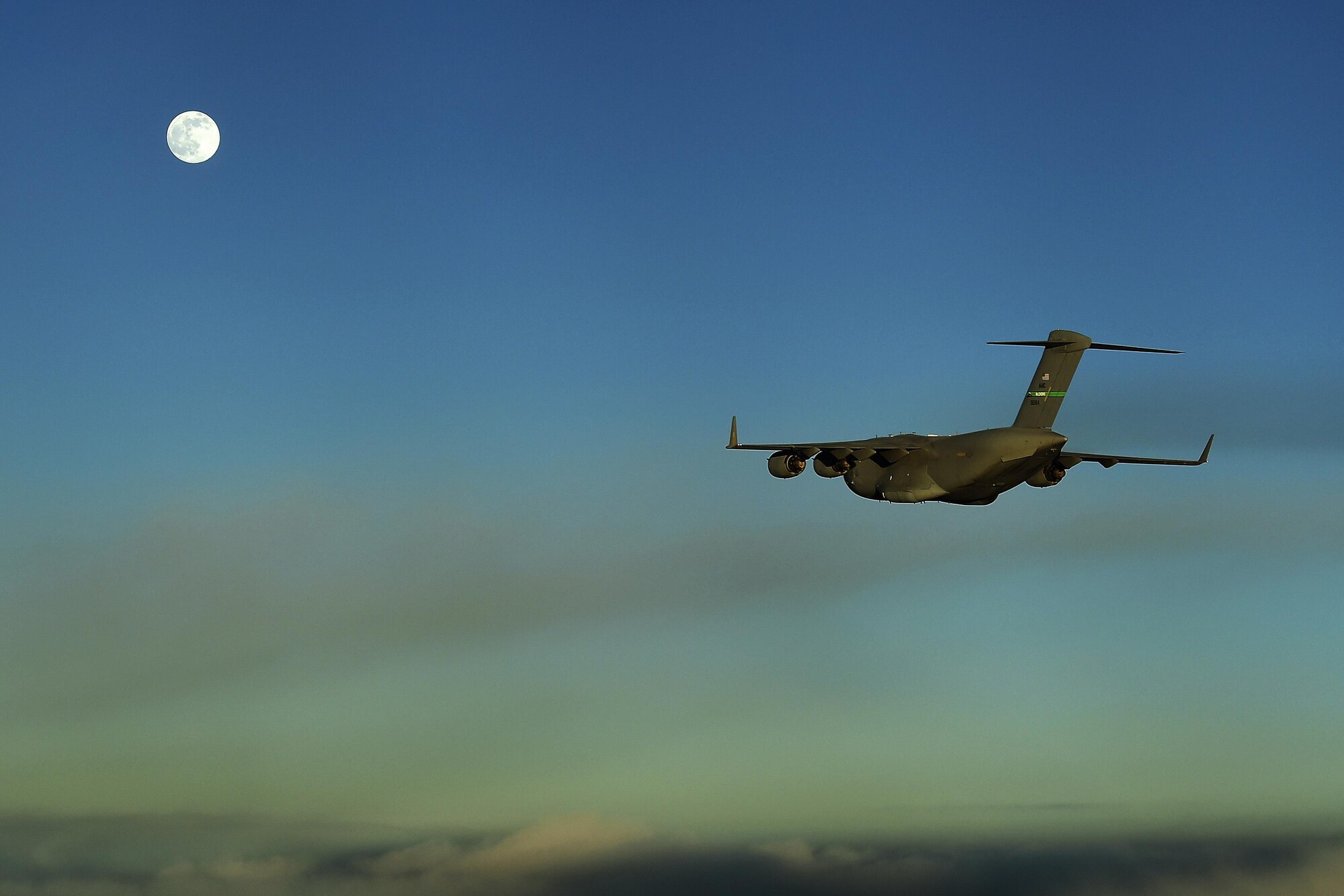 A 62nd Airlift Wing C-17 Globemaster III from Joint Base Lewis-McChord, Wash., flies over the Atlantic Ocean June 19, 2016 in route to Gabon, Africa in support of exercise Central Accord 2016. U.S. Army Africa's exercise Central Accord 2016 is an annual, combined, joint military exercise that brings together partner nations to practice and demonstrate proficiency in conducting peacekeeping operation. (U.S. Air Force photo/Tech. Sgt. Tim Chacon)