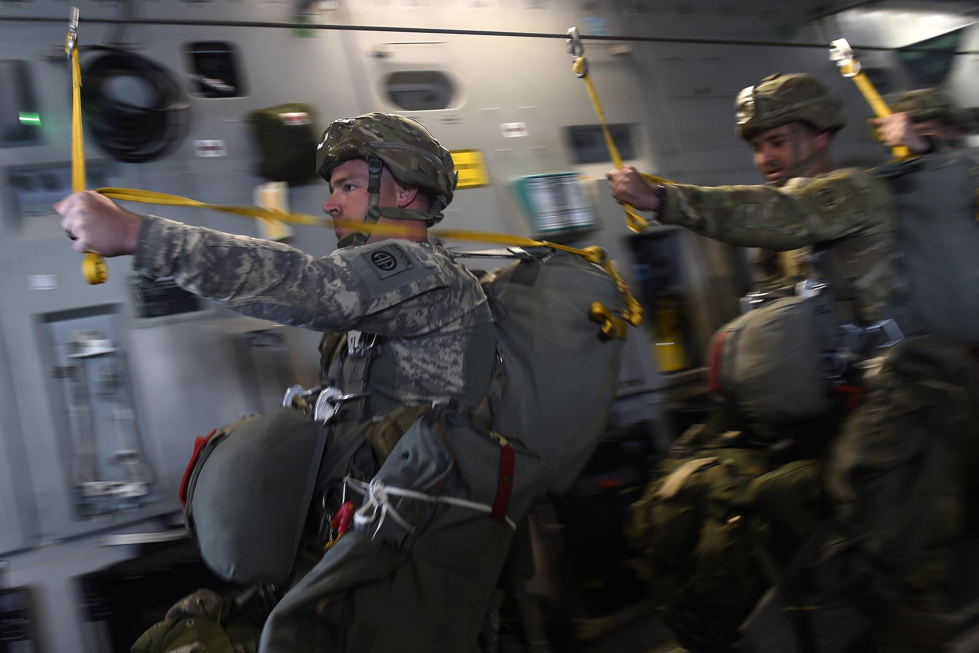 Soldiers from the 82nd Airborne, Fort, Bragg, N.C., conduct a static-line jump out of a 62nd Airlift Wing C-17 Globemaster III aircraft June 20, 2016, in Libreville, Gabon Africa during exercise Central Accord 2016. U.S. Army Africa's exercise Central Accord 2016 is an annual, combined, joint military exercise that brings together partner nations to practice and demonstrate proficiency in conducting peacekeeping operation. (U.S. Air Force photo/Tech. Sgt. Tim Chacon)