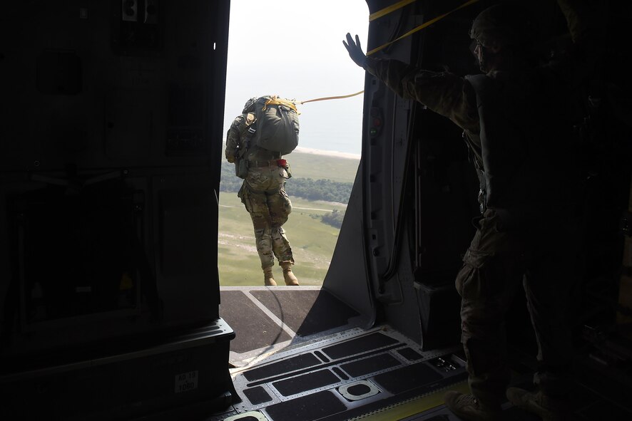 A Solider from the 82nd Airborne Division, Fort Bragg, N.C., exits a 62nd Airlift Wing C-17 Globemaster III during personnel air drops over Libreville, Gabon Africa June 20, 2016, during exercise Central Accord 2016. U.S. Army Africa's exercise Central Accord 2016 is an annual, combined, joint military exercise that brings together partner nations to practice and demonstrate proficiency in conducting peacekeeping operation. (U.S. Air Force photo/Tech. Sgt. Tim Chacon)