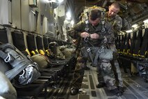 French paratroopers prepare for a static-line jump out of a 62nd Airlift Wing C-17 Globemaster III, stationed out of Joint Base Lewis-McChord, Wash., June 22, 2016 near Libreville, Gabon Africa during exercise Central Accord 2016. U.S. Army Africa's exercise Central Accord 2016 is an annual, combined, joint military exercise that brings together partner nations to practice and demonstrate proficiency in conducting peacekeeping operation. (U.S. Air Force photo/Tech. Sgt. Tim Chacon)