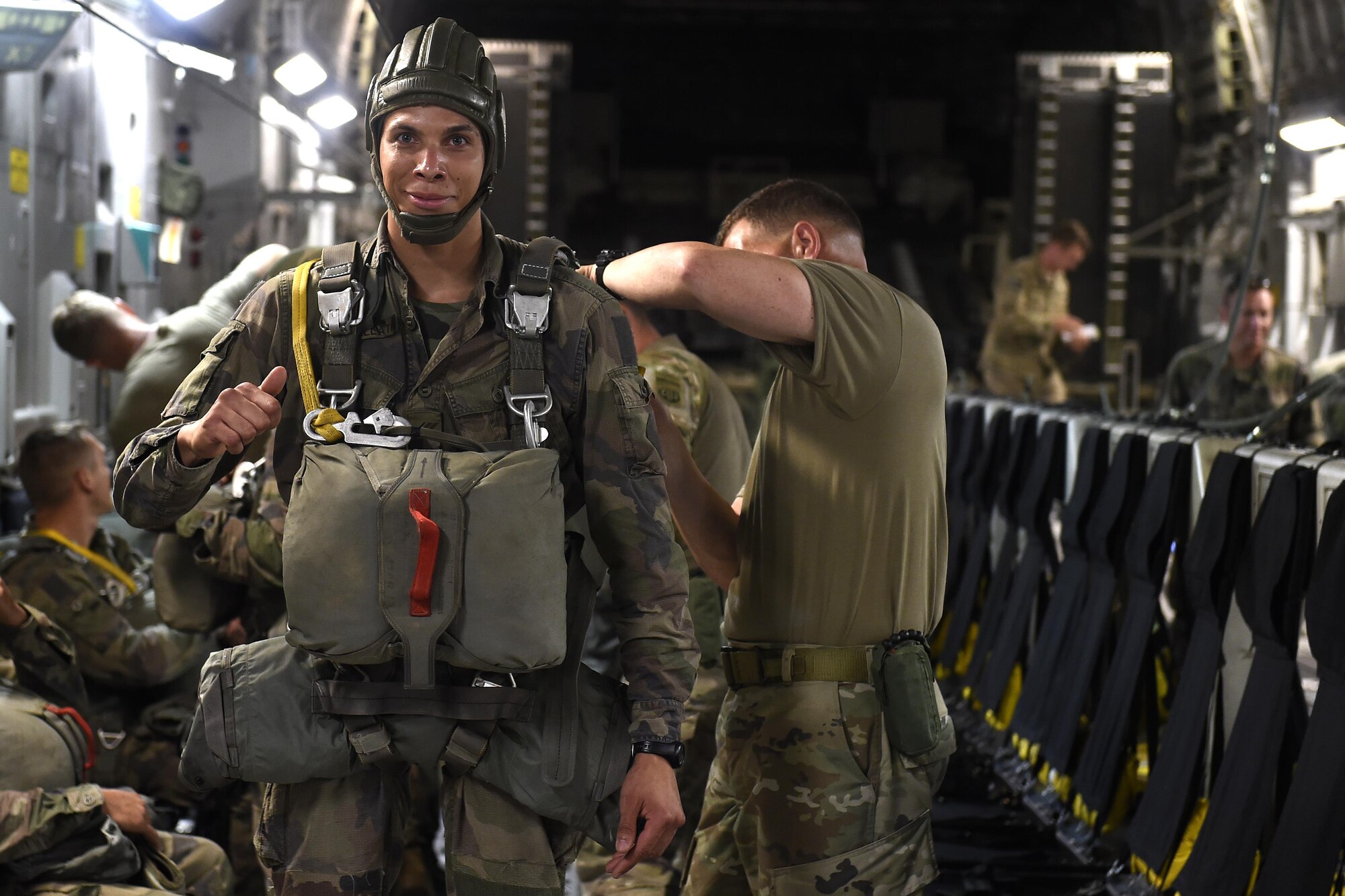 A French Paratrooper prepares for a static-line jump of a 62nd Airlift Wing C-17 Globemaster III June 22, 2016 near Libreville, Gabon Africa during Central Accord 2016. U.S. Army Africa's exercise Central Accord 2016 is an annual, combined, joint military exercise that brings together partner nations to practice and demonstrate proficiency in conducting peacekeeping operation. (U.S. Air Force photo/Tech. Sgt. Tim Chacon)
