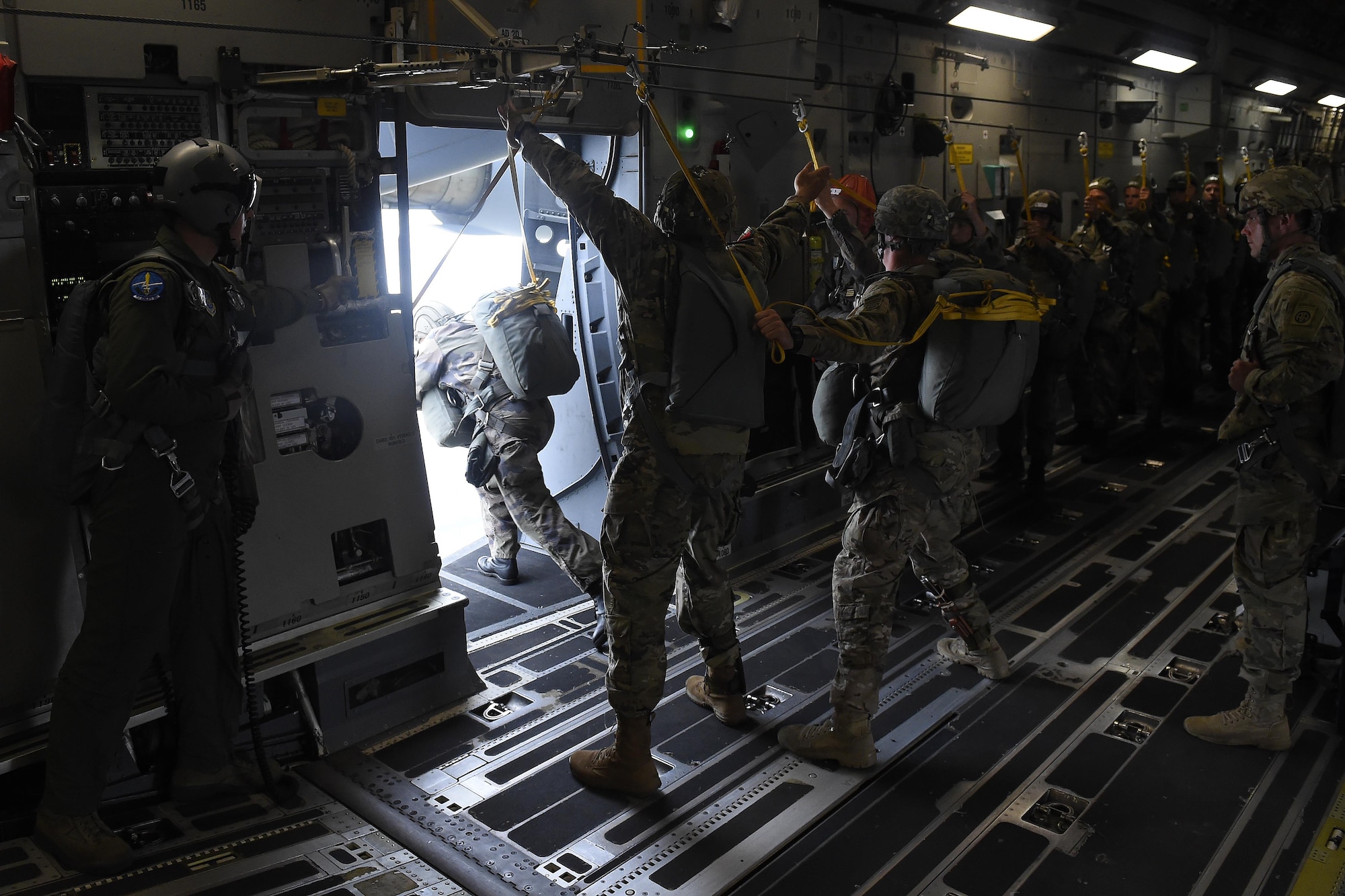 82nd Airborne Division and French paratroopers prepare to conduct a static-line jump from a 62nd Airlift Wing C-17 Globemaster III June 22, 2016 near Libreville, Gabon Africa during exercise Central Accord 2016. U.S. Army Africa's exercise Central Accord 2016 is an annual, combined, joint military exercise that brings together partner nations to practice and demonstrate proficiency in conducting peacekeeping operation. (U.S. Air Force photo/Tech. Sgt. Tim Chacon)