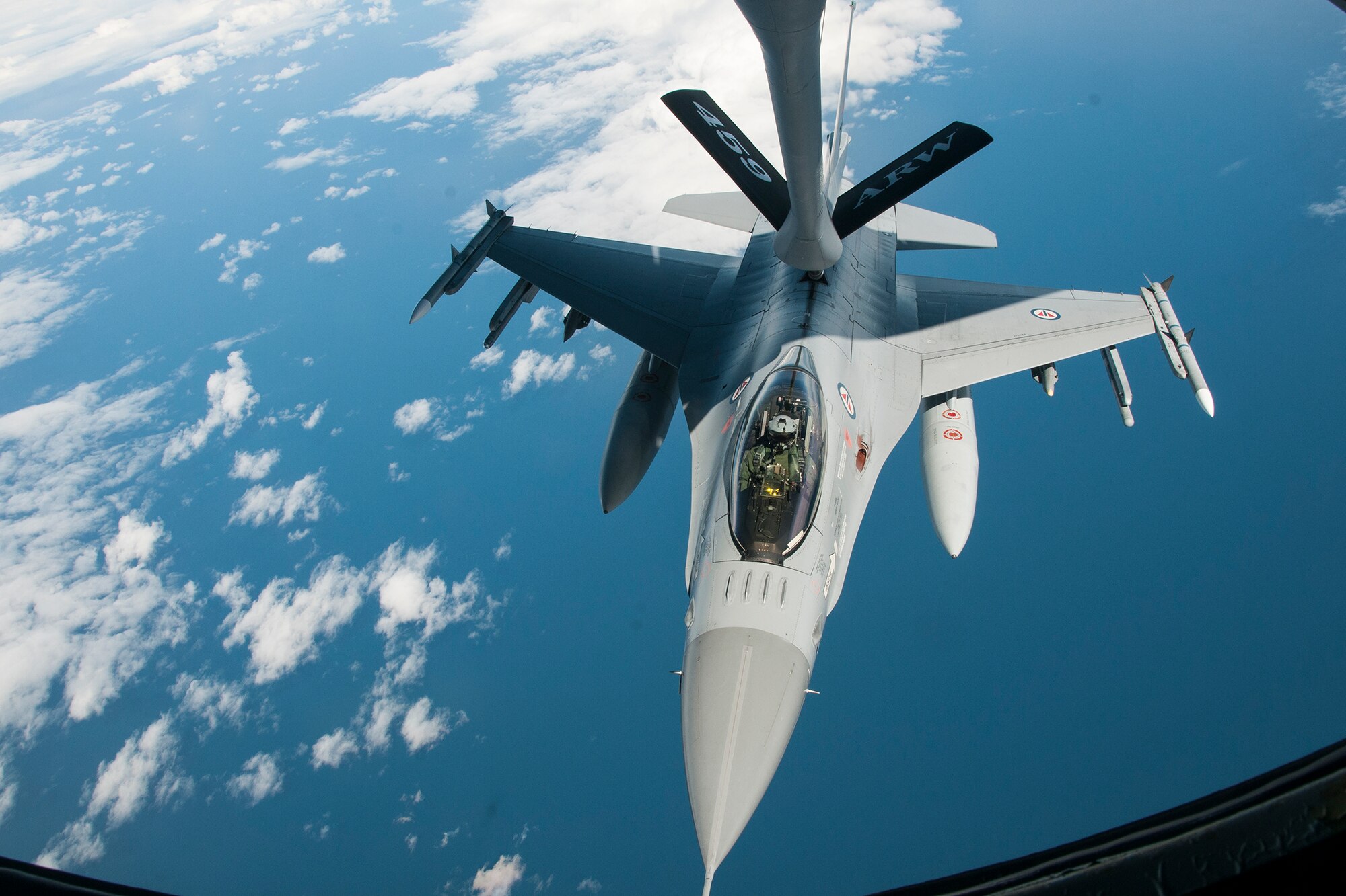 A Norwegian Air Force F-16 is refueled by a 459th Air Refueling Wing KC-135R Stratotanker over Norway June 13, 2016. Members of the 459th ARW, to include pilots, boom operators and maintainers, are in Europe from mid-June to late July to help provide training and refueling support for Operation Atlantic Resolve. OAR aims to ensure peace and stability in Eastern Europe in the wake of Russia’s intervention in Ukraine.  (U.S. Air Force photo/Staff Sgt. Kat Justen)