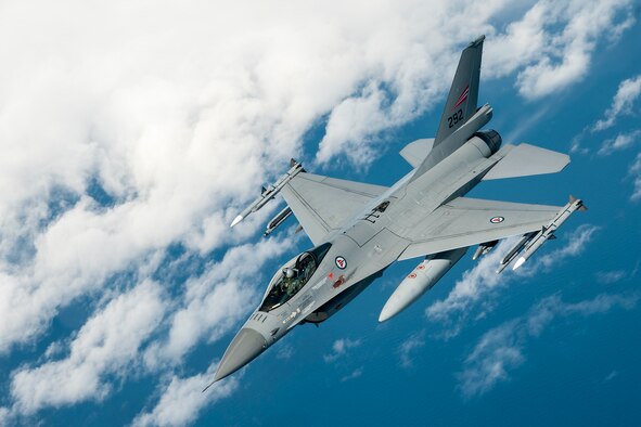 A Norwegian Air Force F-16 is seen from the window of a 459th Air Refueling Wing KC-135R Stratotanker after an inflight refueling over Norway June 13, 2016. Members of the 459th ARW, to include pilots, boom operators and maintainers, are in Europe from mid-June to late July to help provide training and refueling support for Operation Atlantic Resolve. OAR aims to ensure peace and stability in Eastern Europe in the wake of Russia’s intervention in Ukraine.  (U.S. Air Force photo/Staff Sgt. Kat Justen)