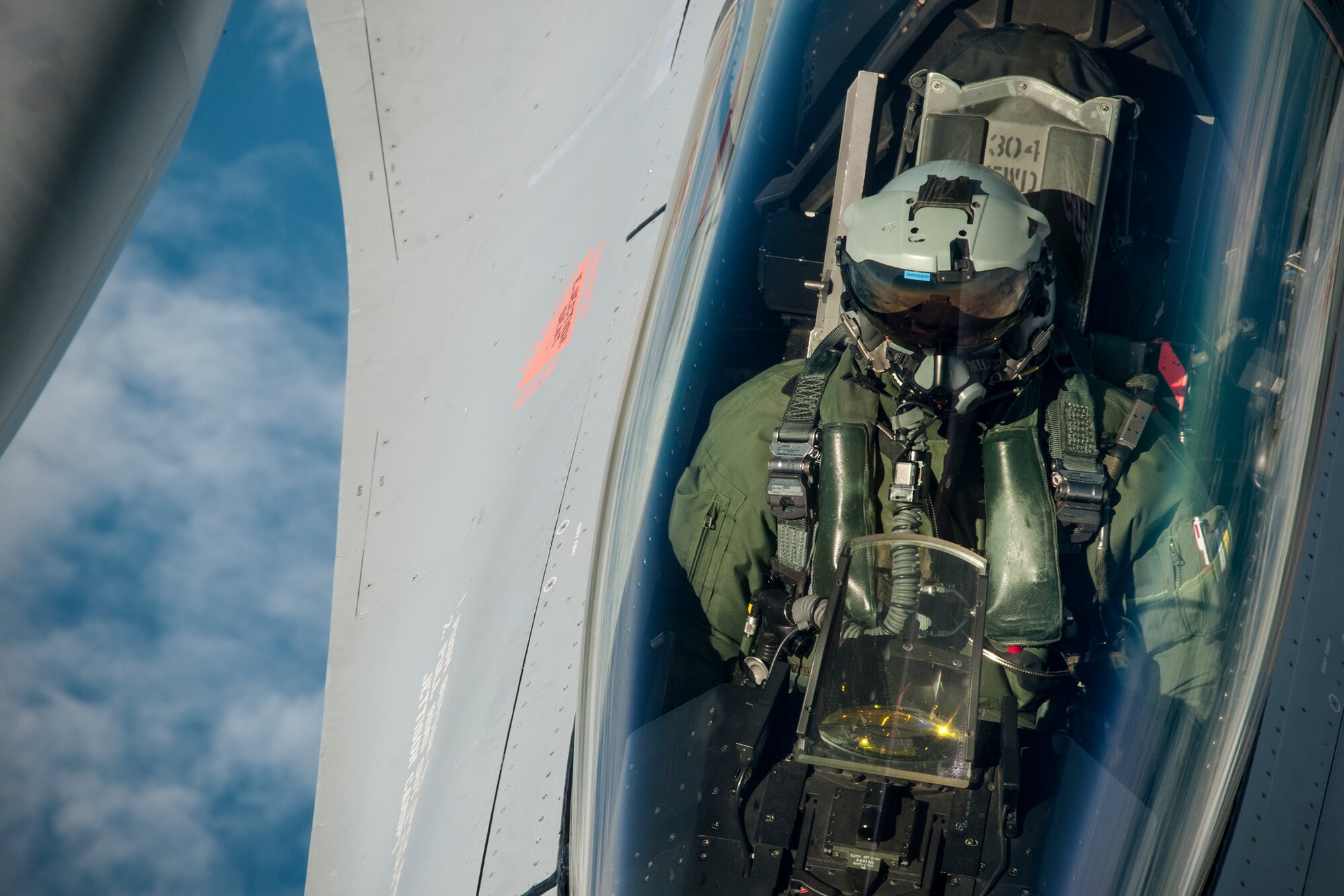 A Norwegian Air Force F-16 pilot waits for his aircraft to receive fuel from a 459th Air Refueling Wing KC-135R Stratotanker over Norway June 13, 2016. Members of the 459th ARW, to include pilots, boom operators and maintainers, are in Europe from mid-June to late July to help provide training and refueling support for Operation Atlantic Resolve. OAR aims to ensure peace and stability in Eastern Europe in the wake of Russia’s intervention in Ukraine.  (U.S. Air Force photo/Staff Sgt. Kat Justen)