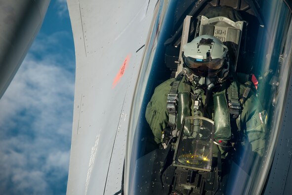 A Norwegian Air Force F-16 pilot waits for his aircraft to receive fuel from a 459th Air Refueling Wing KC-135R Stratotanker over Norway June 13, 2016. Members of the 459th ARW, to include pilots, boom operators and maintainers, are in Europe from mid-June to late July to help provide training and refueling support for Operation Atlantic Resolve. OAR aims to ensure peace and stability in Eastern Europe in the wake of Russia’s intervention in Ukraine.  (U.S. Air Force photo/Staff Sgt. Kat Justen)