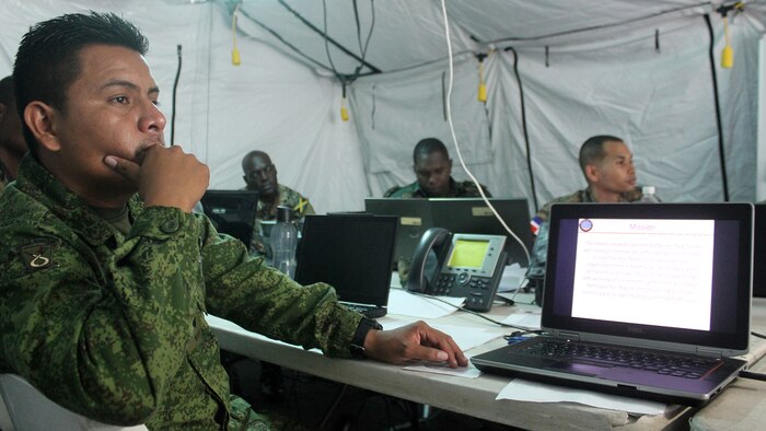 Capt. Edwin Oliva, executive officer of Operations, Belize Defense Force, listens to a brief on Command and Control during Phase II of exercise Tradewinds 2016, at Up Park Camp, Jamaica, June 24, 2016.  Tradewinds 2016 is a Chairman of the Joint Chiefs of Staff-approved, U.S. Southern Command-sponsored combined joint exercise conducted in conjunction with 17 partner nations to enhance the collective ability of their defense forces and constabularies to counter transnational organized crime and conduct humanitarian/disaster relief operations, while developing strong relationships and reinforcing human rights awareness.