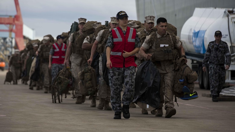 U.S. Marines prepare to go aboard the HMAS Adelaide at Port of Brisbane, Queensland, Australia, June 16, 2016. This marks the first time Marines and sailors from Marine Rotational Force - Darwin have embarked in such numbers on an Australian HMAS. This opportunity allows for MRF-D to expand the partnership capabilities with our Australian allies. The Marines are with 1st Battalion, 1st Marine Regiment, MRF-D, and the Australians are with HMAS Adelaide. 