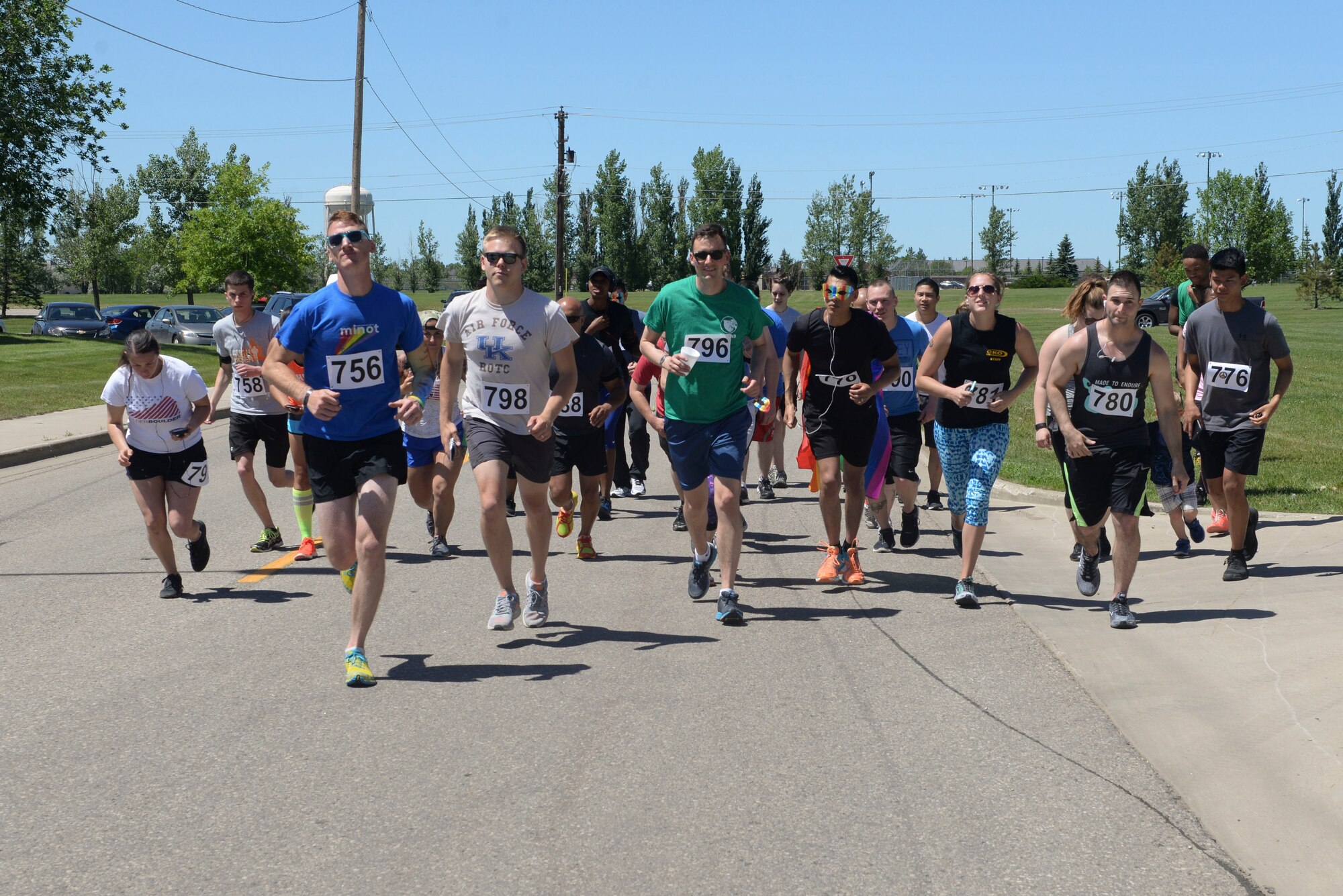 Members of Team Minot and the local community participate in the Orlando memorial 5K at Minot Air Force Base, N.D., June 17, 2016. The race was organized by the Minot AFB Diversity Committee to pay respects to the 49 lives lost in the Orlando shooting June 12. (U.S. Air Force photo/Airman 1st Class Jessica Weissman)