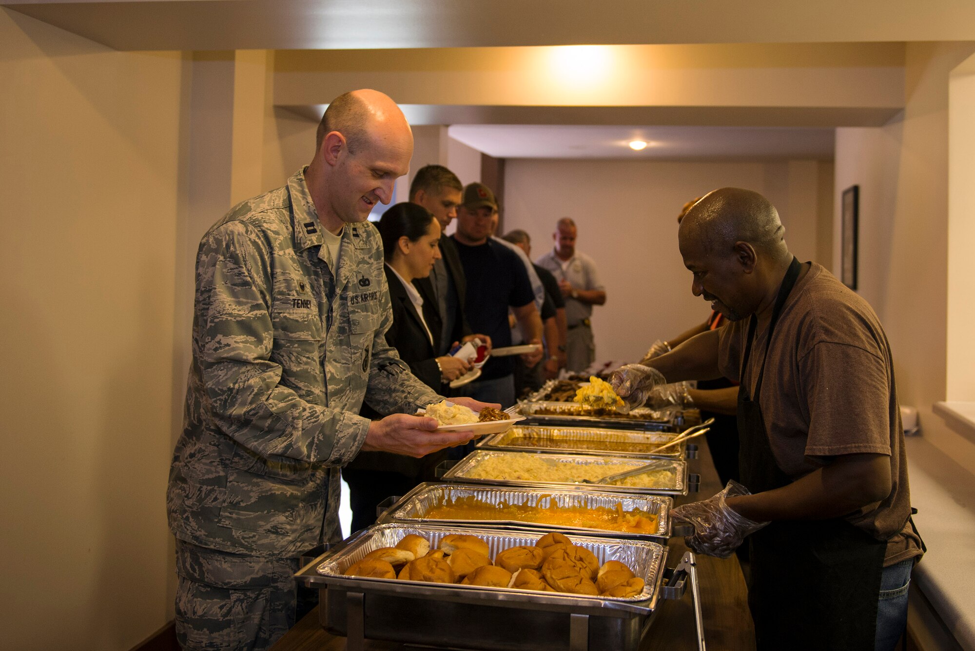 U.S. Air Force Airmen gather with local, state and federal law enforcement agencies during a luncheon hosted by the AF Office of Special Investigations Detachment 211, June 27, 2016, at Moody Air Force Base, Ga. AFOSI contributes to the Air Force’s five concentrated capabilities: protecting critical technologies and information, detecting and mitigating threats, providing global specialized services, conducting major criminal investigations and engaging foreign adversaries and threats offensively. 
(U.S. Air Force photo by Airman 1st Class Greg Nash/Released)
