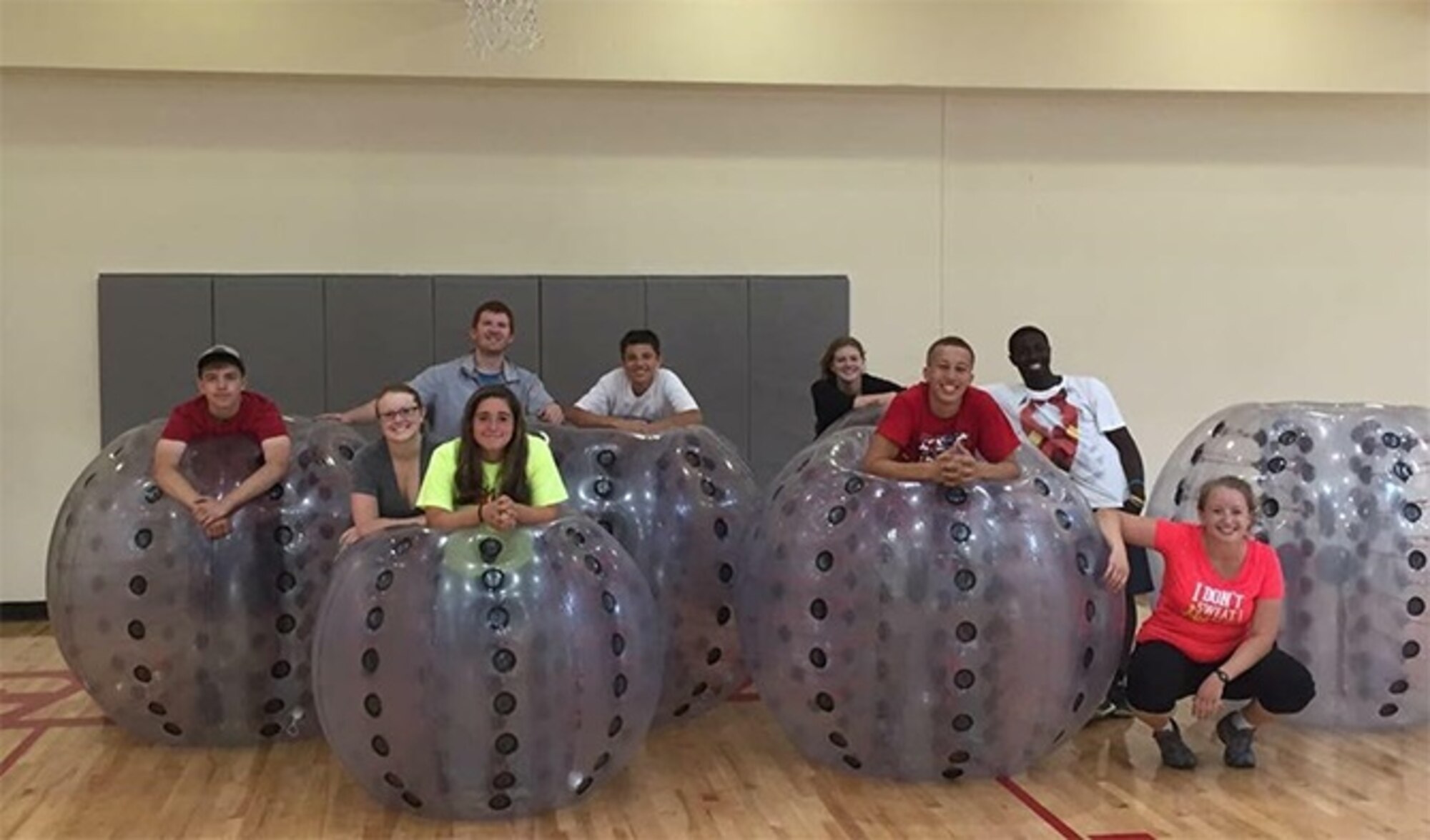 Fairchild Teen Center members take a group shot in front of their "Bubble Soccer" implements. The Teen Center received an award from the Boys and Girls Club of America for increasing its enrollment. 